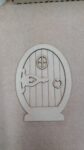 Fairy_door_with_large_hinge_and_stick_on_window